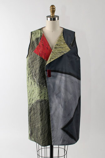 Andrea Geer’s Long Reversible Vest, which features her electric pen drawings on the front and her original painting on the reverse. The look is topped off with a handmade polymer clay pin.